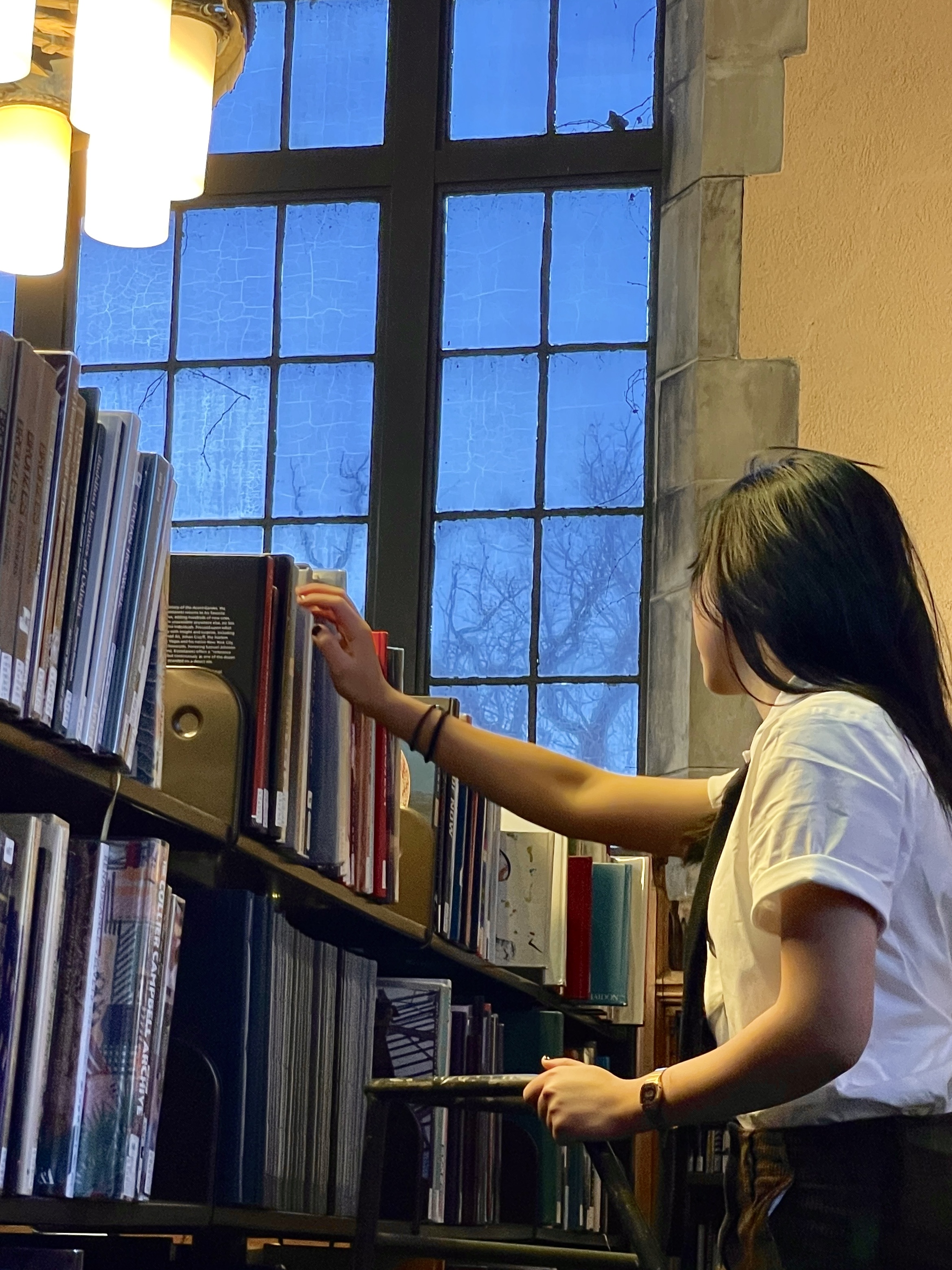 me browsing books in deering library