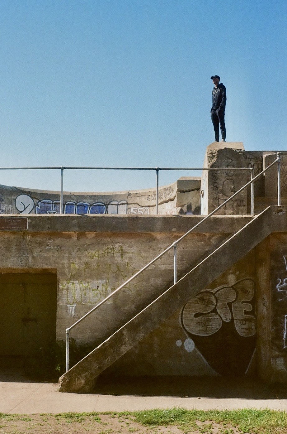 guy standing on concrete
